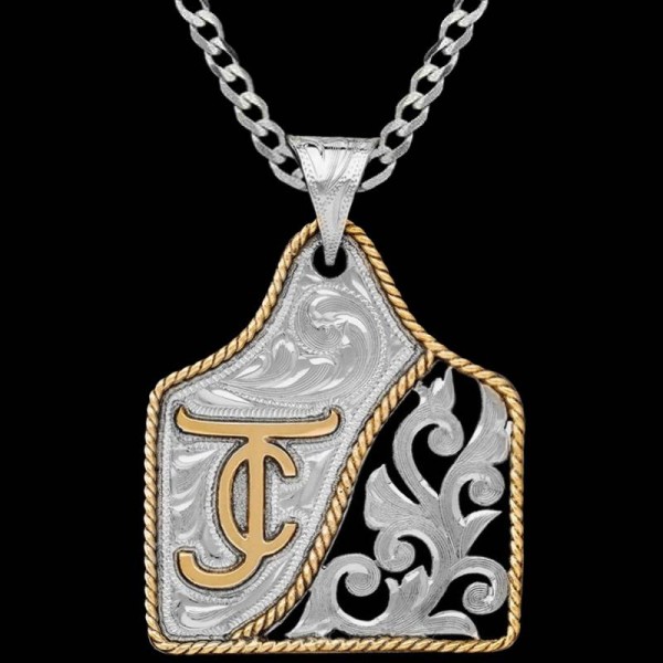 Our Espresso Cow Tag Necklace features a hand engraved German Silver base adorned with intricate scrollwork.. accentuated with Jeweler's Bronze ranch logo and a classic rope edge.  Pair it with a special discount sterling silver chain! 